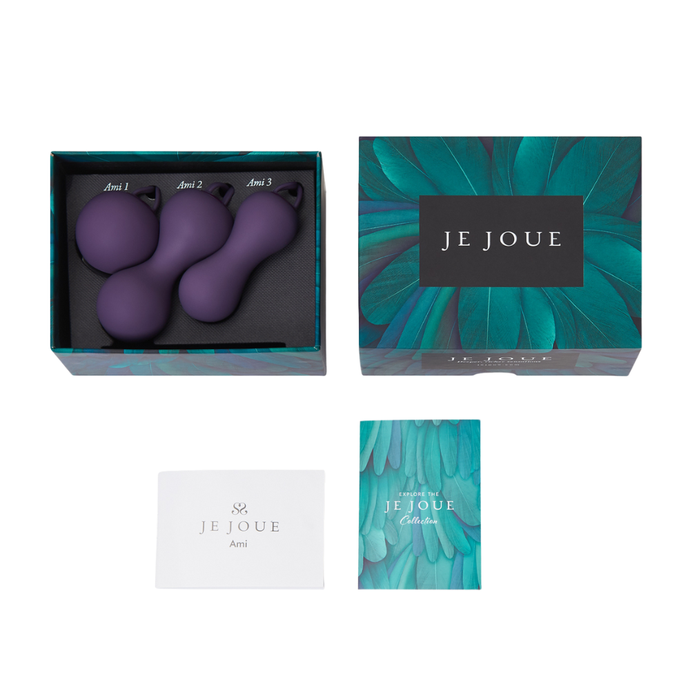A purple set of three Ami pelvic floor trainers by Je Joue in the box sitting next to the lid and papers saying Je Joue.