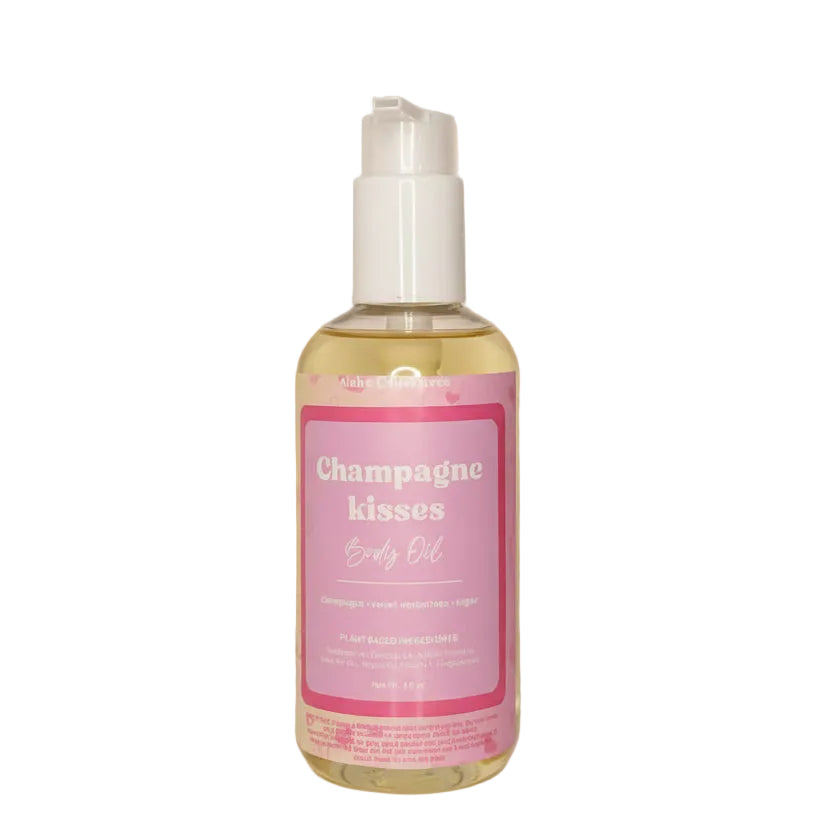 A bottle of Champagne Kisses Body oil from Aloha Collection against a white background.