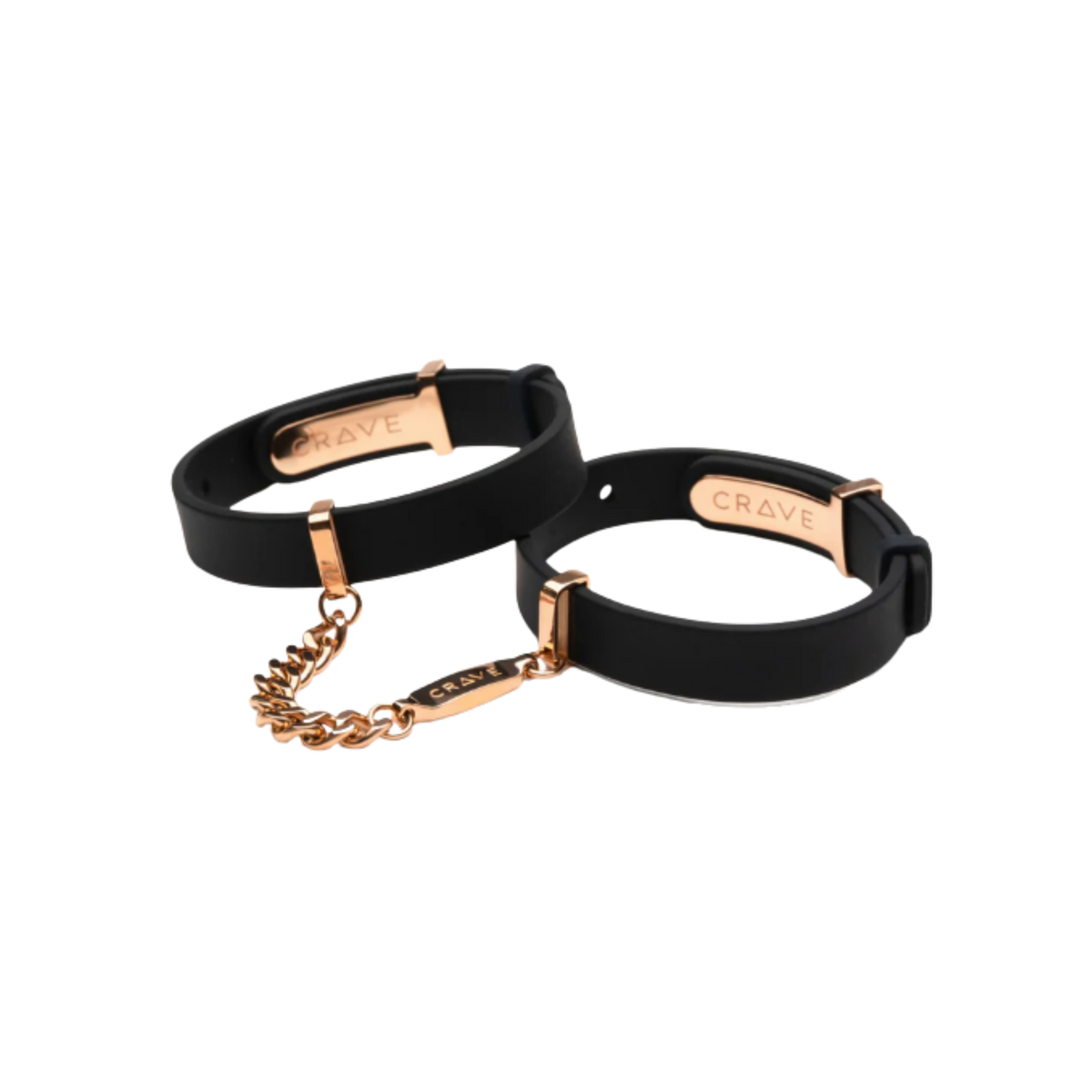 A set of black cuffs with a gold chain.