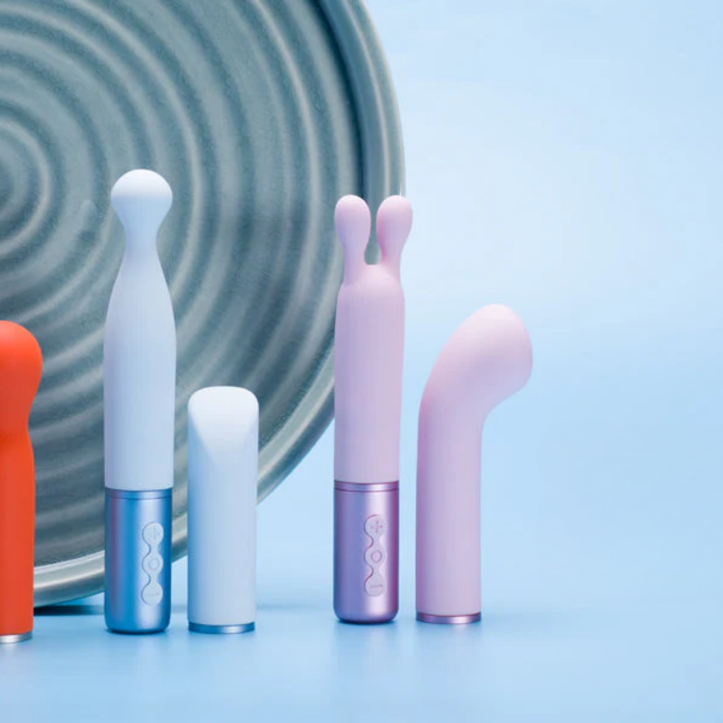 A blue and a purple Naughty Collection Vibrator Duo against a white background blue background.