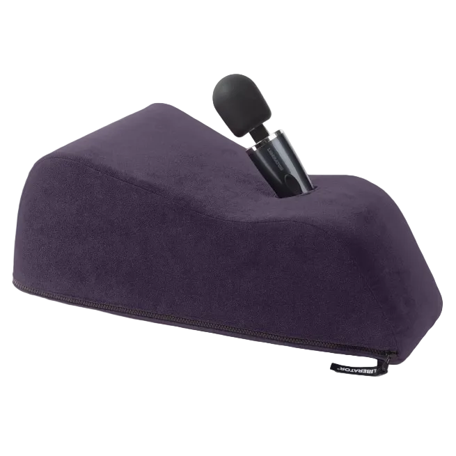 A aubergine Wanda Toy Mount, Bedroom Furniture by Liberator holding a wand.