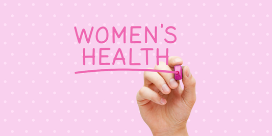 Women's Health written out on a pink whiteboard