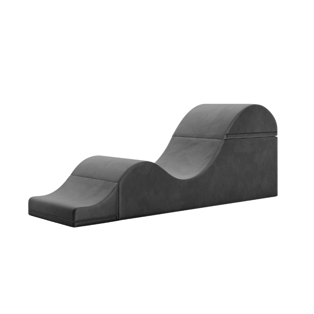Black aria chaise folded out into a chaise on a white background