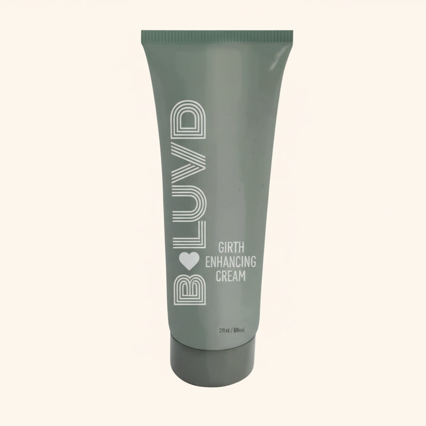 A green bottle of B Luvd Girth Enhancement Cream against a white background.