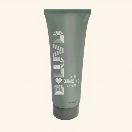 A green bottle of B Luvd Girth Enhancement Cream against a white background.
