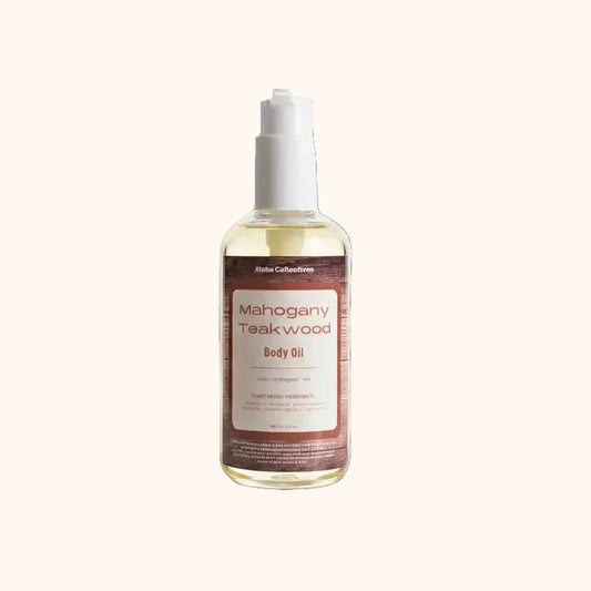 A bottle of Mahogany Teakwood Body oil from Aloha Collection against a white background.