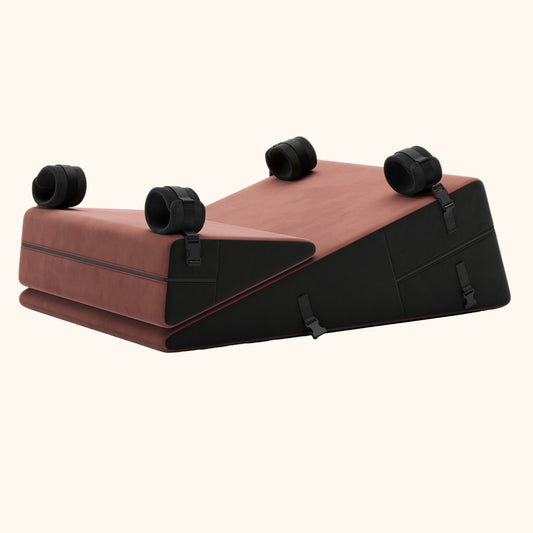 Ultraleather and raspberry Bondage Wedges & Ramps, Bedroom Furniture by Liberator against white background.