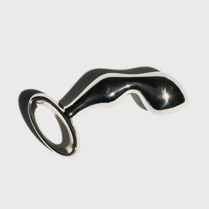 A silver Cassa plug against a white background.