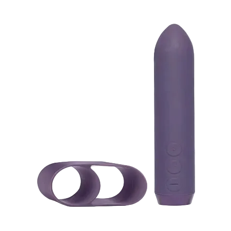 A purple Classic Bullet by Je Joue next to a purple finger sleeve.