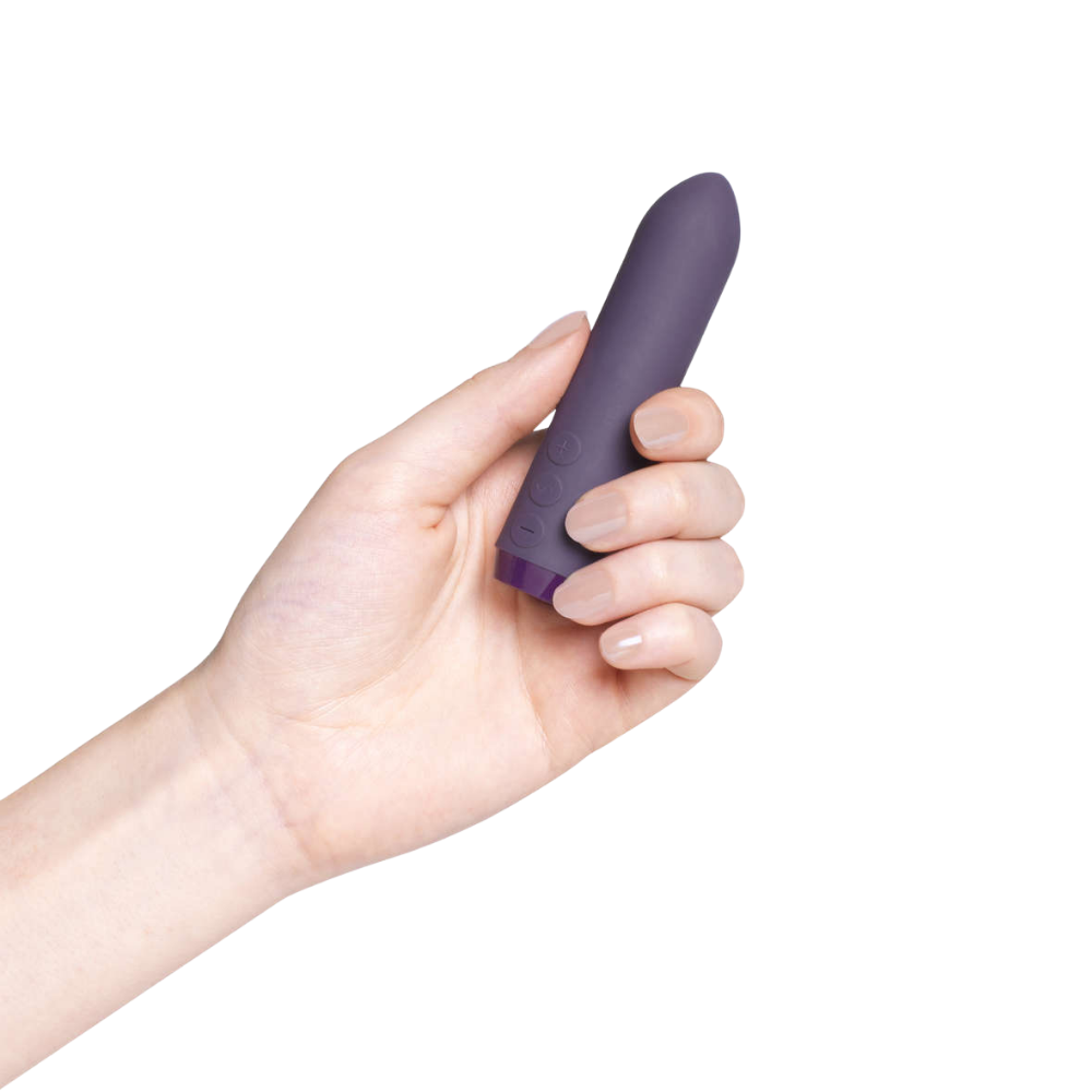 A purple Classic Bullet by Je Joue being held in a hand.