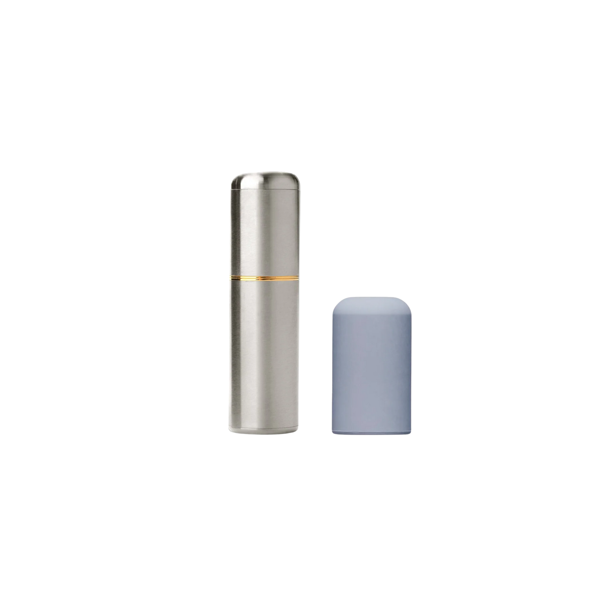 A silver Crave bullet sitting next to the grey silicone cap.