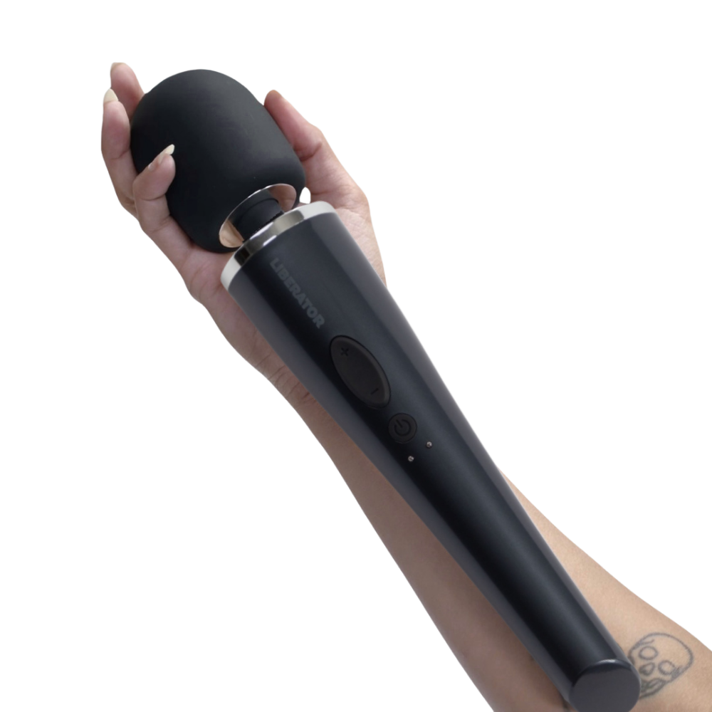Hand holding a black wand on a white background