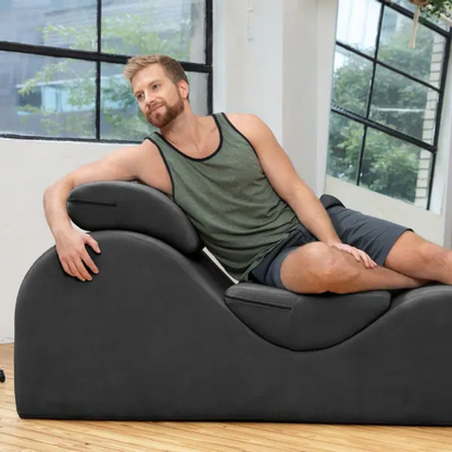 man on a black esse lounger