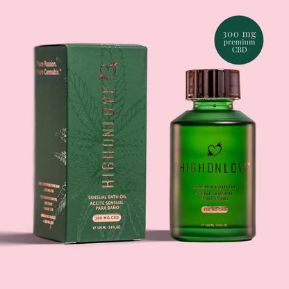 Green bottle of Elevated Bath & Body Oil by High on Love sitting next to it's green box showing it contains 300 mg of premium CBD.