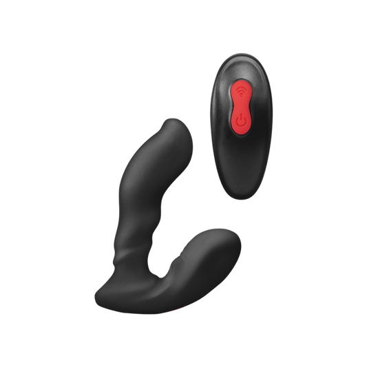 A black Sidetrack prostate vibe by Envy sitting next to the remote.