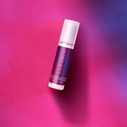 A bottle of Euforia Pheromone Perfume displayed on a pink and purple background.