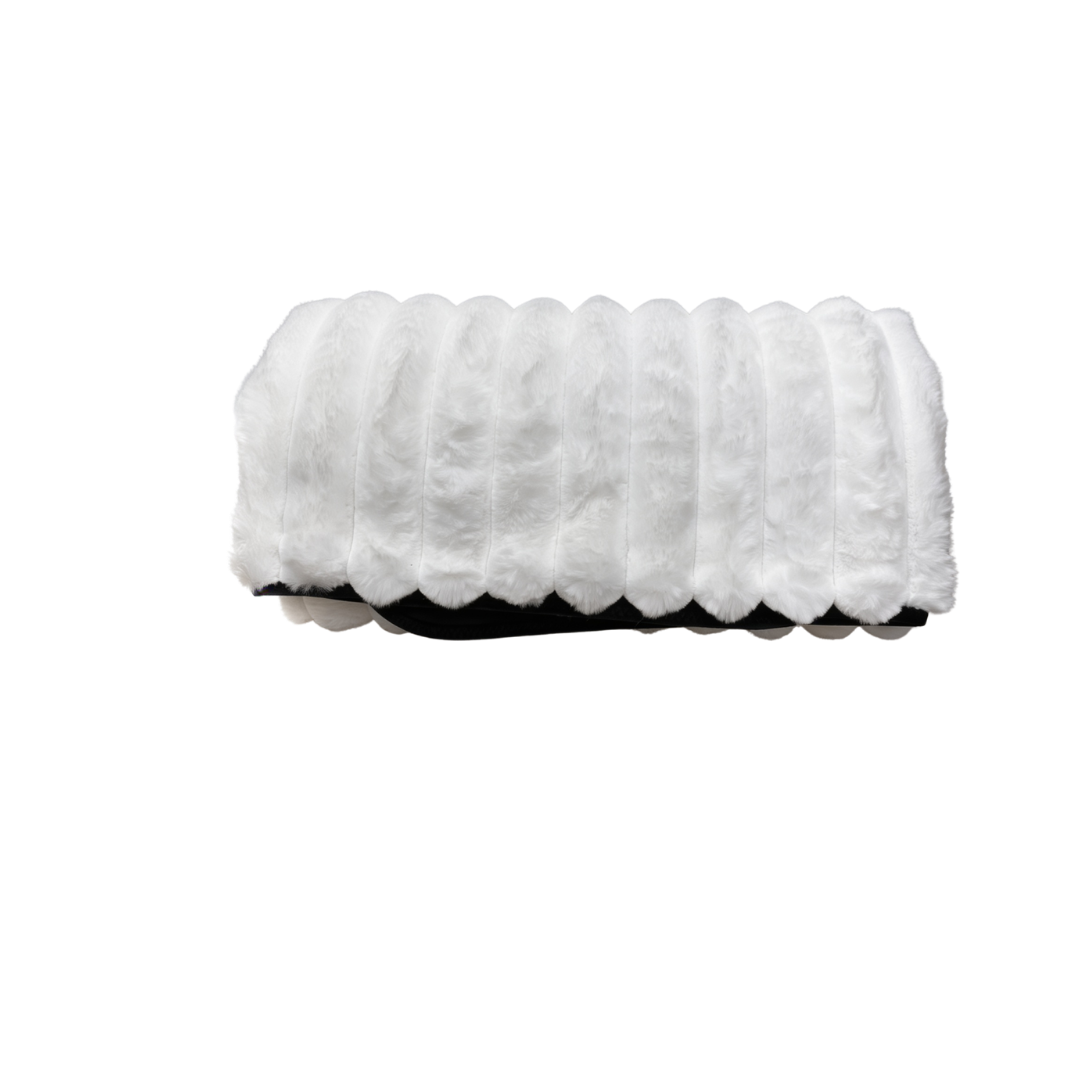 A white Fascinator Luxe Splashproof Fur blanket rolled up.