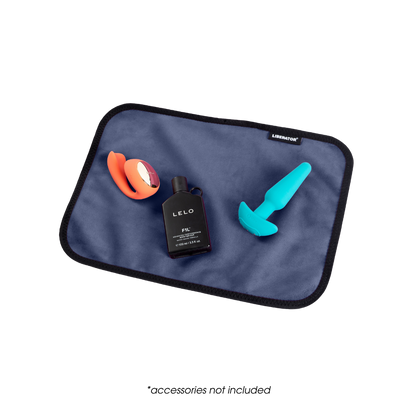 A toy pad size blue Fascinator Splashproof Throws, Bedroom Furniture by Liberator with toys on it.