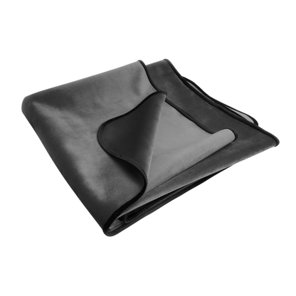 A grey Fascinator Splashproof Throws, Bedroom Furniture by Liberator folded up.
