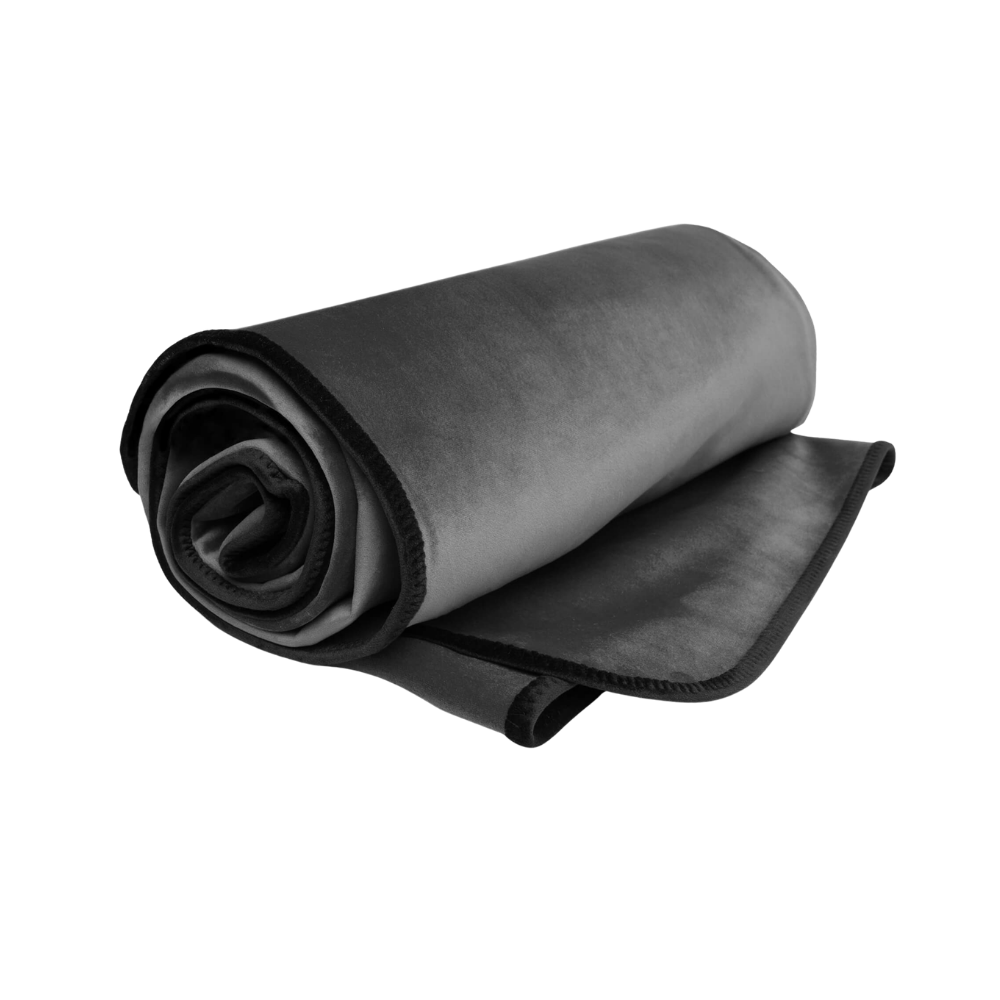 A grey Fascinator Splashproof Throws, Bedroom Furniture by Liberator rolled up.