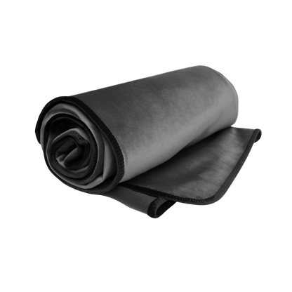 A grey Fascinator Splashproof Throws, Bedroom Furniture by Liberator rolled up.