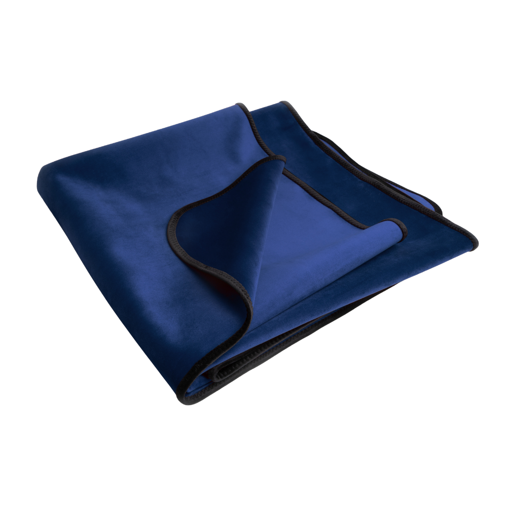 An indigo Fascinator Splashproof Throws, Bedroom Furniture by Liberator folded up.