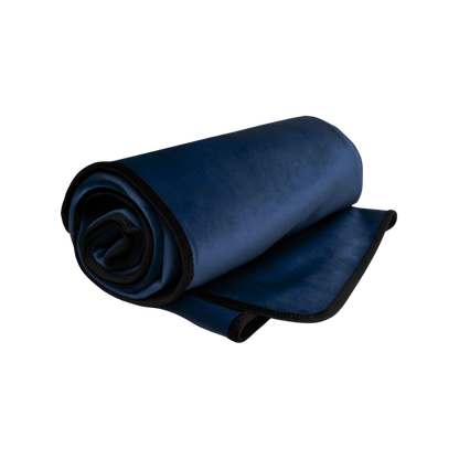 An indigo Fascinator Splashproof Throws, Bedroom Furniture by Liberator rolled up.