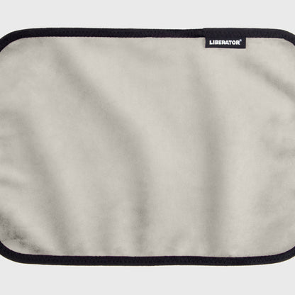 A white cream Fascinator Splashproof Throws, Bedroom Furniture by Liberator unrolled up against a white background.