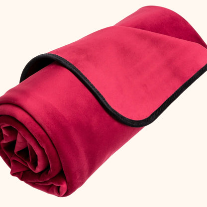 A merlot Fascinator Splashproof Throws, Bedroom Furniture by Liberator against a white background.
