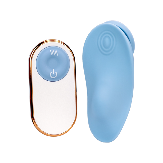 A blue Get Nauti clitoral vibrator next to the remote.