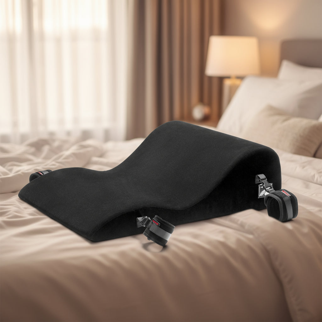 A black Hipster Bondage, Roleplay & Restraints bedroom funiture with cuffs by Liberator on a bed.