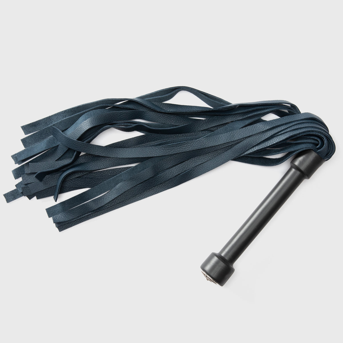 A black Flogger against a white background showing what comes in the Ho Ho Ooooh Box.