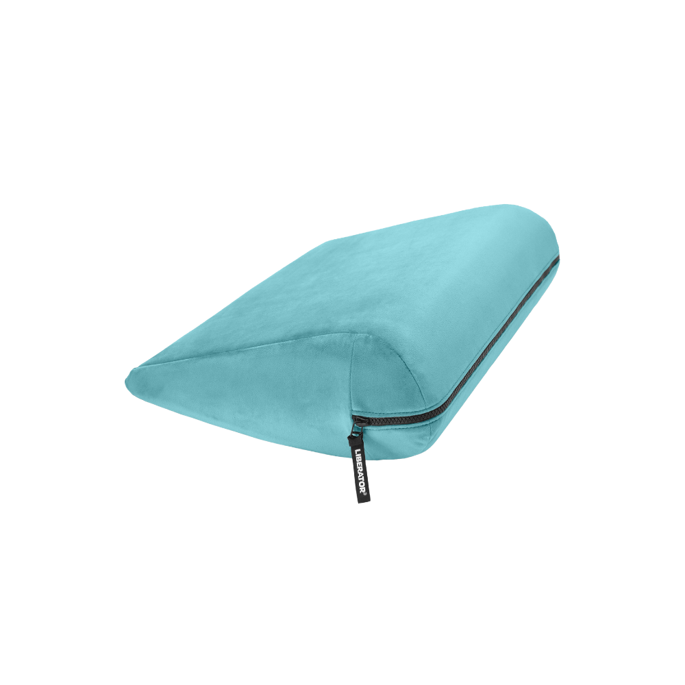 Turquoise double curved Jaz pillow with a black zipper on a white background