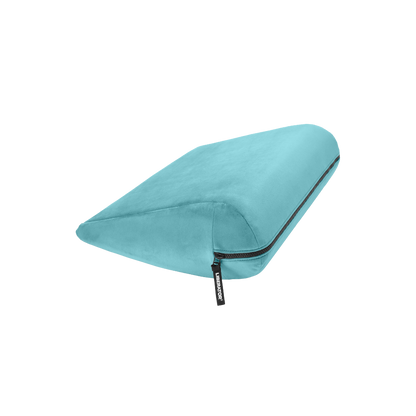 Turquoise double curved Jaz pillow with a black zipper on a white background