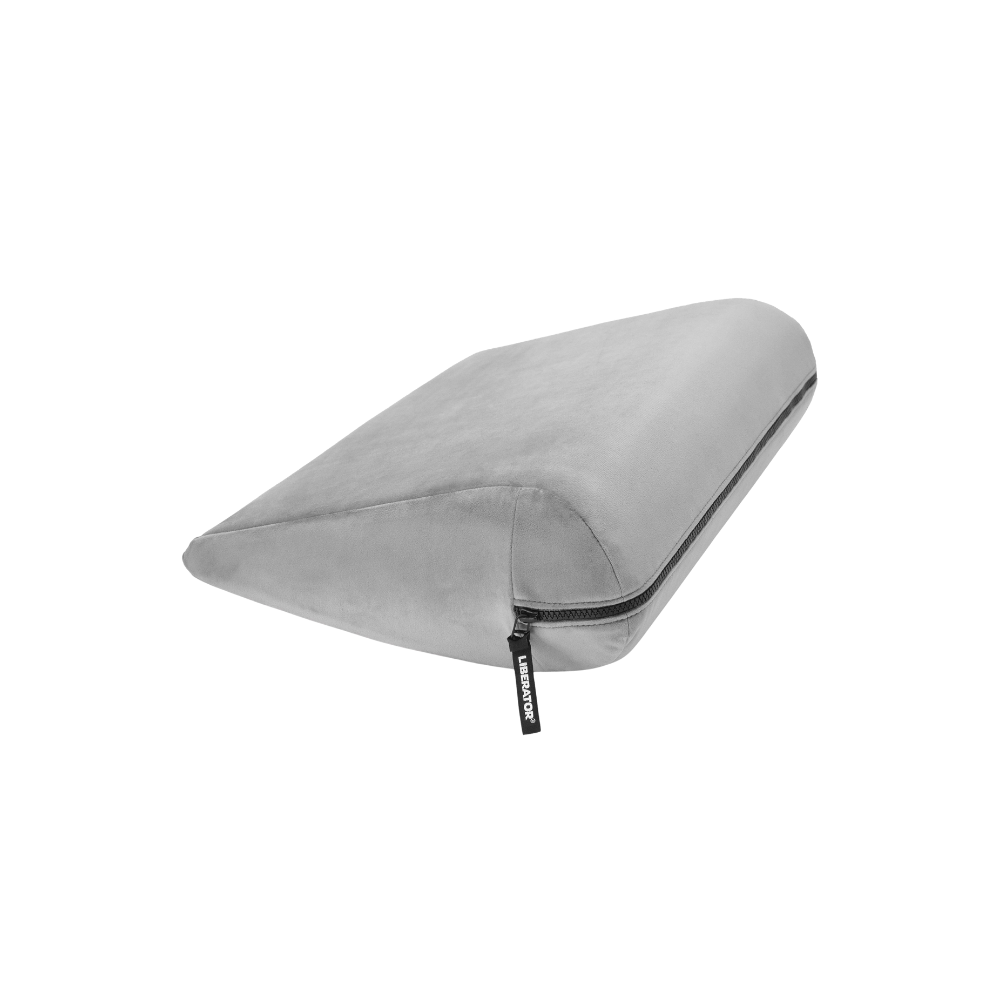 Grey double curved Jaz pillow with a black zipper on a white background