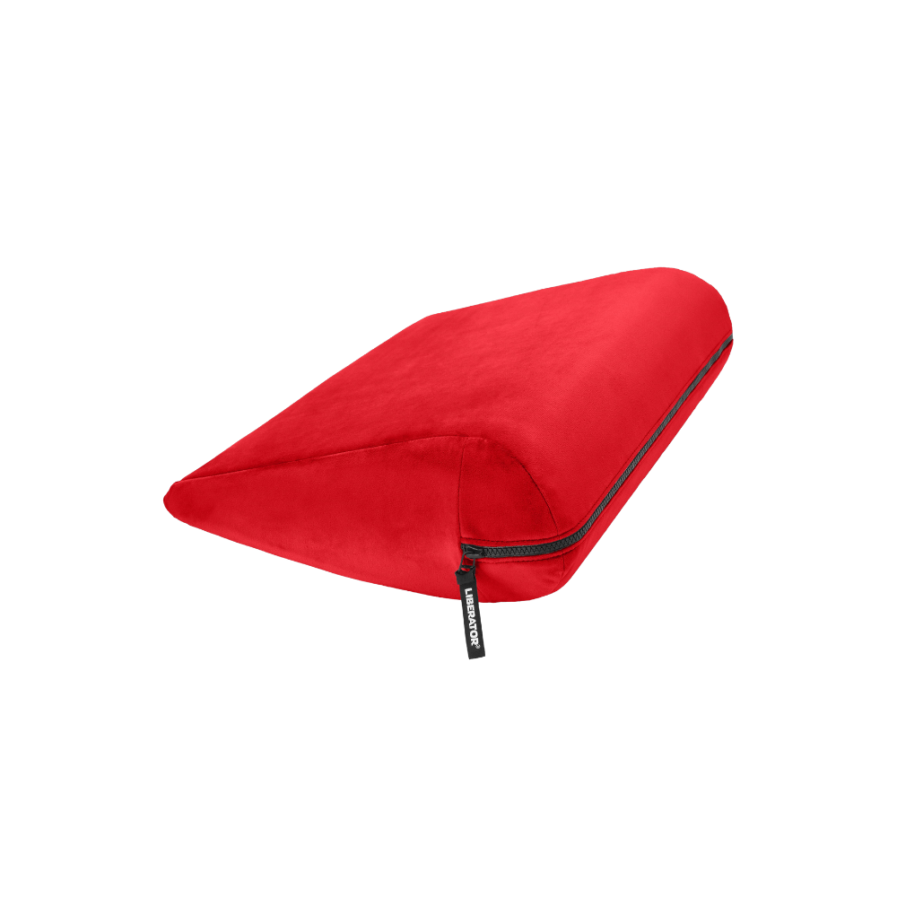 Red double curved Jaz pillow with a black zipper on a white background