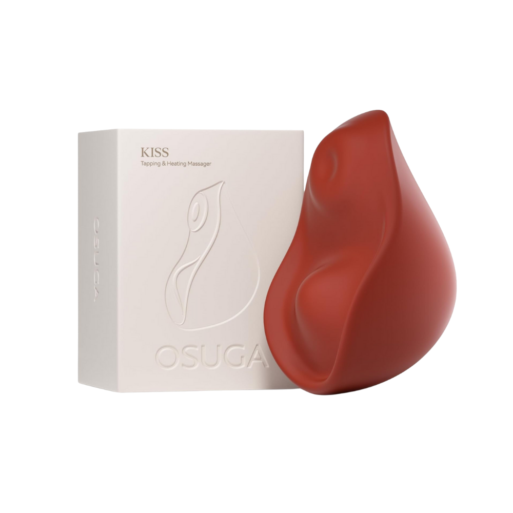 A red Kiss dual-tapping vibrator by Liberator next to its box.