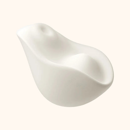 A white Kiss dual-tapping vibrator by Liberator against a white background.
