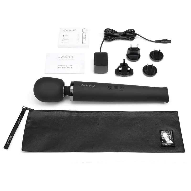 Black Le Wand device with accessories on a white background