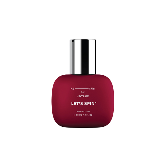 A red bottle of Let's Spin Intimacy Gel lubricant by Joylux.