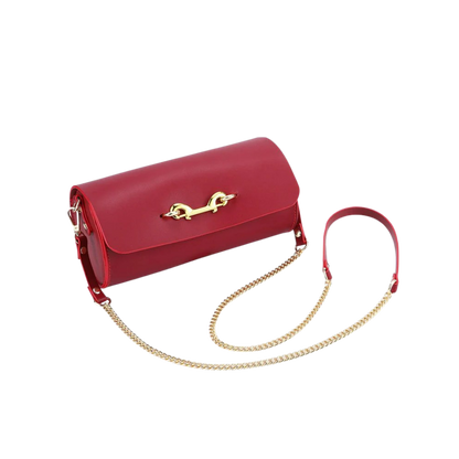 A closed red Luxe Bondage Kink purse.