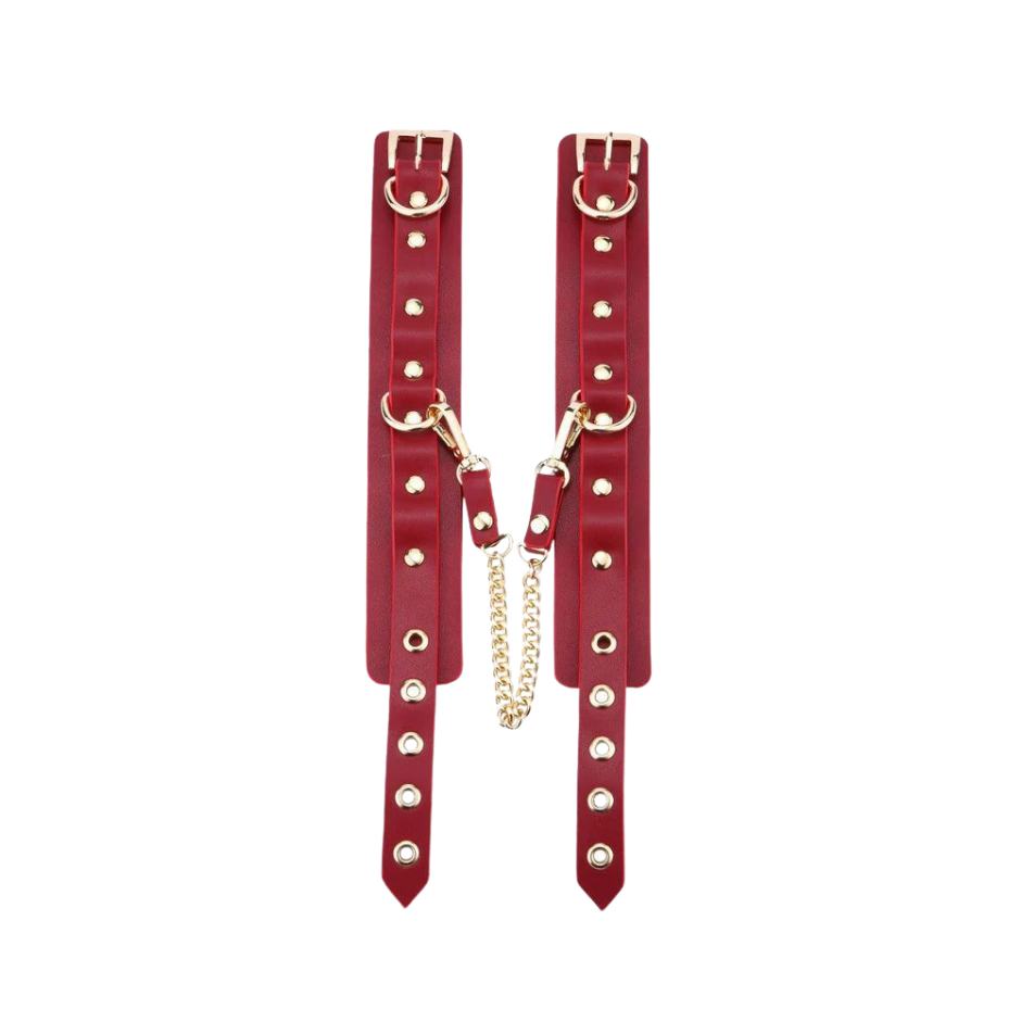 A set red Luxe Bondage cuffs opened up and chained.