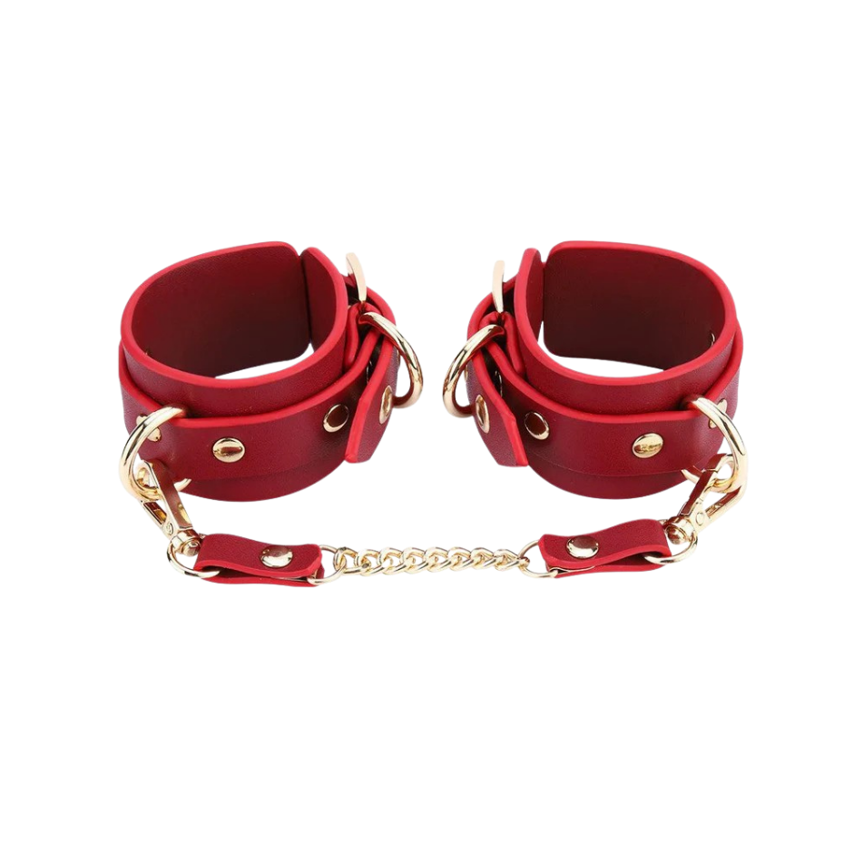 A set red Luxe Bondage cuffs chained together.