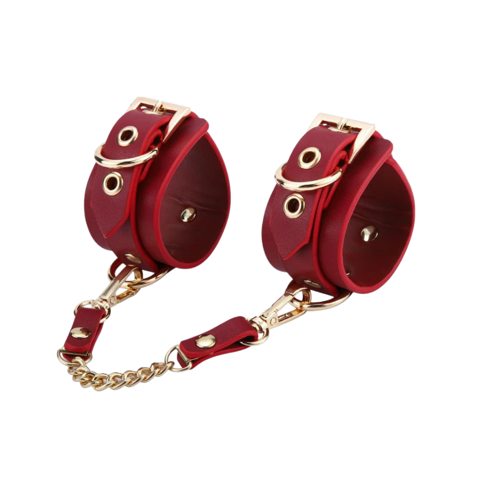 A set red Luxe Bondage cuffs chained together.