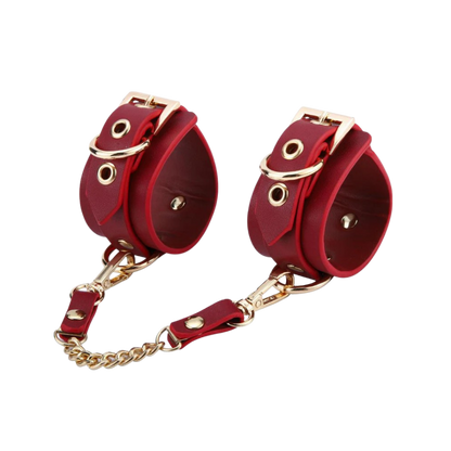A set red Luxe Bondage cuffs chained together.