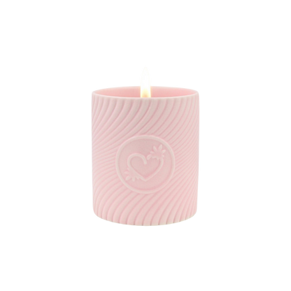 A pink massage candle mini by High On Love.