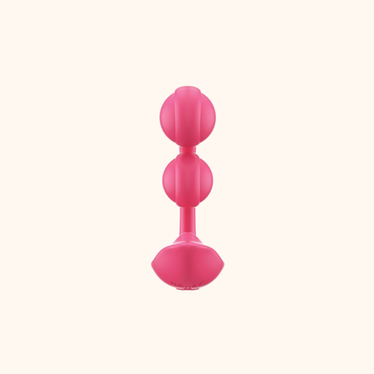The back of a pink Melody Wearable remote vibrator against a white background.