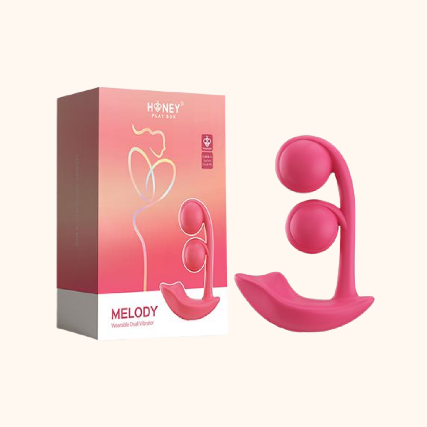 A pink Melody Wearable remote vibrator against a white background sitting next to the box.