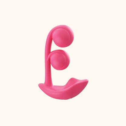 A pink Melody Wearable remote vibrator against a white background.