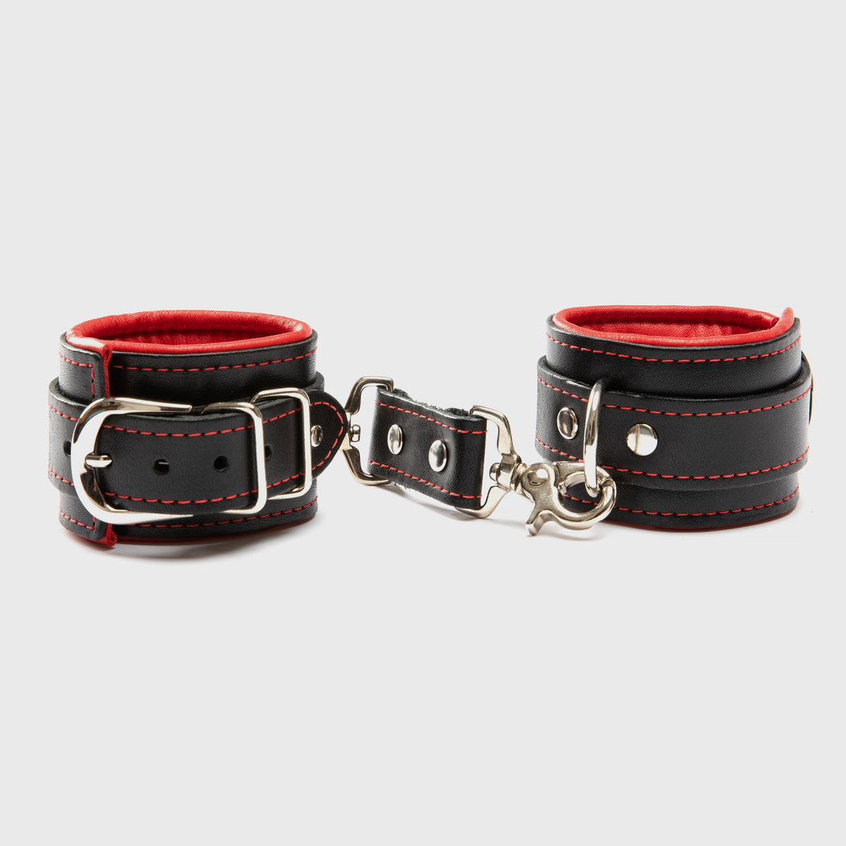 A black and red pair of handcuffs against a white background showing what could come in the Merry & Wild Box.